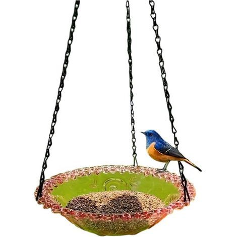 Available in one color only: pink. Materials: metal and polystyrene. Hanging feeder for pet birds, ideal for outdoor use. (1/4)