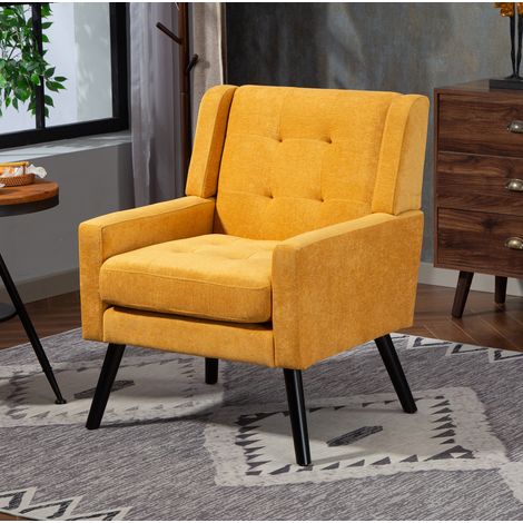 Poltrona gialla imbottita capitonné con gambe in legno, design compatto (1/5)