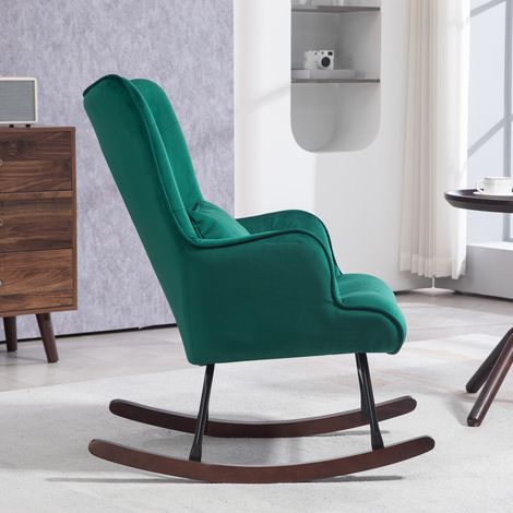 Fauteuil berçant vert velours, haut dossier, coussin moelleux et accoudoirs rembourrés, idéal salon ou chambre. Modèle relaxant. (1/5)