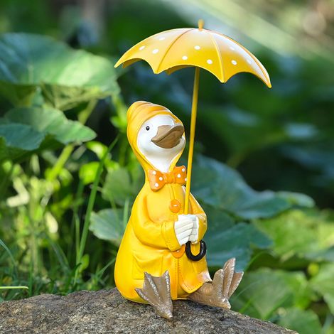 Statue de canard avec parapluie — une sculpture animale décorative pour les jardins et les espaces extérieurs. (1/5)