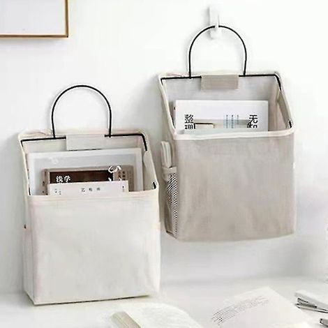 These wall-mounted storage bags, made of cotton and linen, are perfect for storing books and magazines.