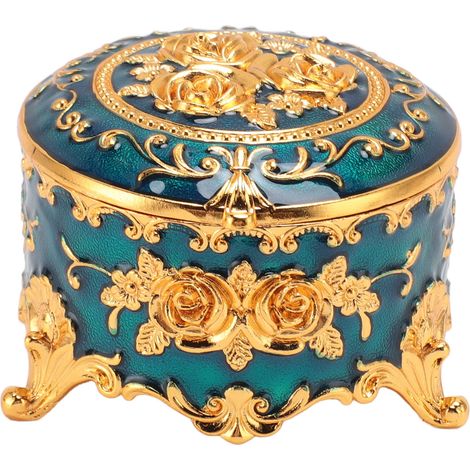 Elegante portagioie vintage rotondo in metallo intagliato a mano con motivo floreale dorato e organizer blu per piccoli oggetti. (1/5)