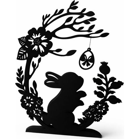 Conejo de Pascua decorativo bajo el arco con un huevo de Pascua, negro