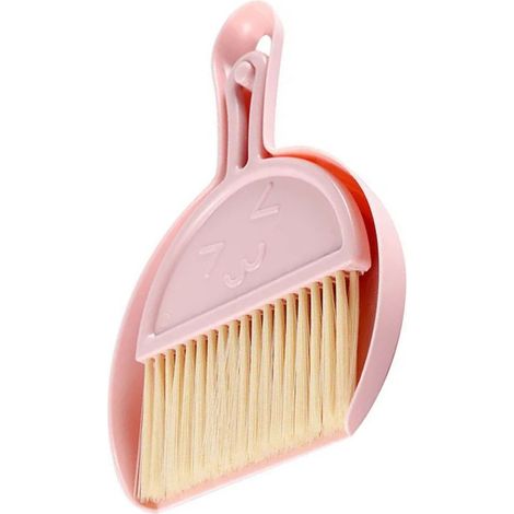 Mini balai et pelle à poussière en plastique rose avec visage souriant, pour un nettoyage efficace et portable sur table ou au bureau. (1/5)