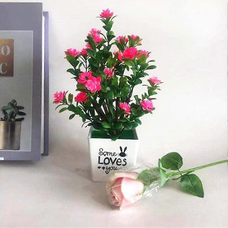 Une plante artificielle en pot apporte une touche naturelle à votre bureau à domicile.rose (1/5)