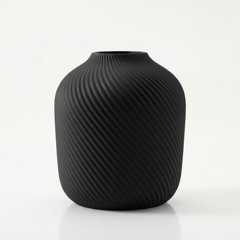 Vaso moderno, minimalista e scanalato di colore nero per fiori ed erbe aromatiche.