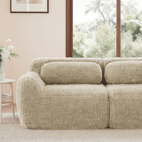 Divano modulare senza braccioli in peluche beige chiaro con seduta ampia e design componibile (1/5)