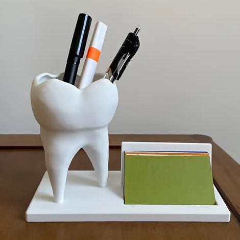 tooth-shaped pen holder with a business card holder, suitable for office desks. It can be used as a desk decoration or as a gift for dentists. (1/4)