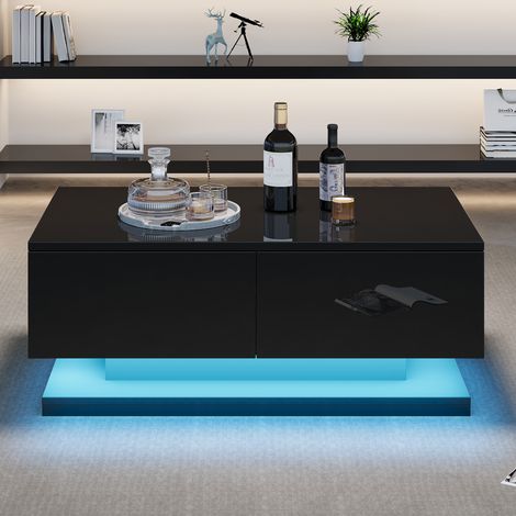 Table de salon en verre noir, mesurant 90×50×38 cm. Tablette convertible avec 2 tiroirs. C’est une table de salon parfaitement adaptée à un intérieur chaleureux, équipée d’un éclairage LED. (1/5)