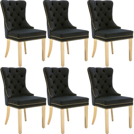 Chaise de salle à manger en velours noir avec anneaux décoratifs ronds et pieds en acier inoxydable doré (1/5)