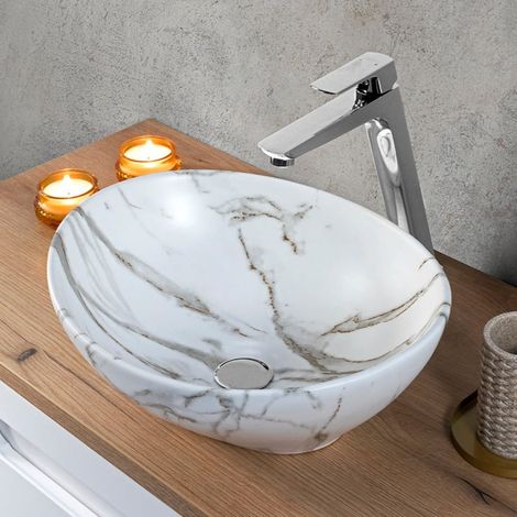 Lavabo da appoggio ovale in ceramica PAT bianco marmorizzato.