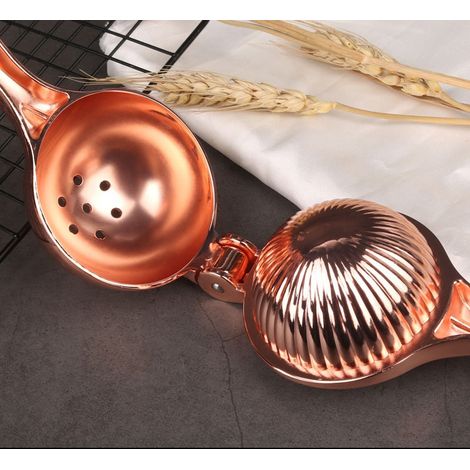 Presse-agrumes manuel en alliage de zinc, couleur or rose (1/3)