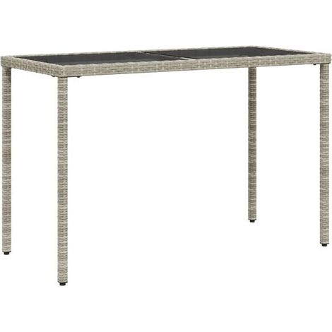 Table de jardin en rotin avec plateau en verre gris clair, mesurant 115 x 54 x 74 cm. (1/5)