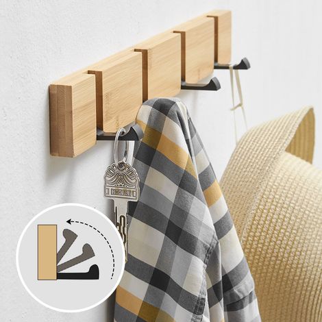 Appendiabiti da parete con 4 ganci a scomparsa, ideale per appendere cappotti, sciarpe, borse e altri accessori, in colore naturale.