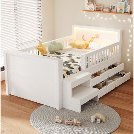 Cama infantil (204x114x79.8 cm), con cabecero de estrellas y lunas, cajones, escalón y barrera, madera blanca (1/5)