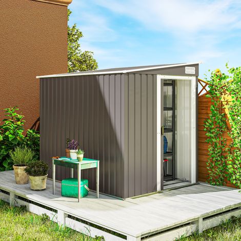Abri de jardin métallique de 1,5 x 2 m avec base. Porte coulissante et toit en pente. Gris clair.