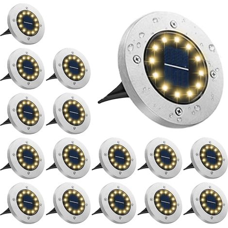Un ensemble de 16 spots solaires encastrables étanches, lumière chaude, 12 ampoules LED – autonomie de 10 heures.