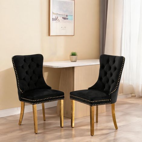 Chaises de salle à manger en velours noir et doré dossier haut (1/5)