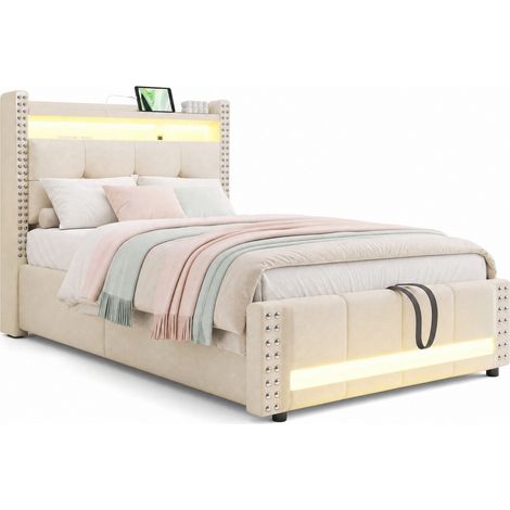 Lit enfant rembourré 90x200 cm avec LED, USB et rangement hydraulique, tête de lit avec étagères, tissu beige, de CHICFURN (1/5)