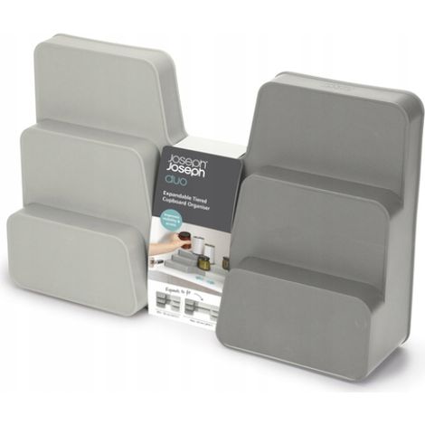 Organizador escalonado extensible Joseph Joseph Duo para armarios, optimiza espacio, diseño flexible y accesible, ideal para utensilios de cocina, limpieza y baño.