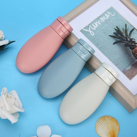 3 flacons vides de shampoing et de gel douche en silicone, format voyage. (1/5)