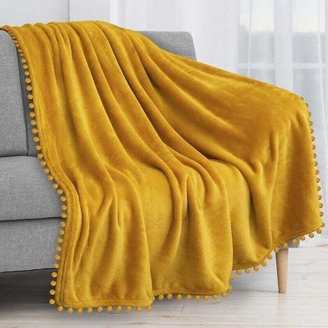Couverture polaire 100 x 120 cm pour canapé avec franges à pompons, jaune moutarde, douce et confortable, en flanelle pour canapé-lit, légère et pelucheuse, toutes saisons (1/4)