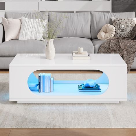 Table basse avec éclairage LED (contrôlé par application)  Structure en MDF  Capacité de charge de 30 kg  Finition haute brillance  Design ouvert avec grand espace de rangement  Table d'appoint pour c