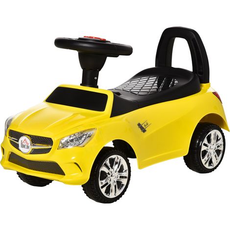 Voiture électrique pour enfant avec volant, phares et musique intégrée, en polypropylène et métal, 63,5 x 28 x 36 cm, jaune