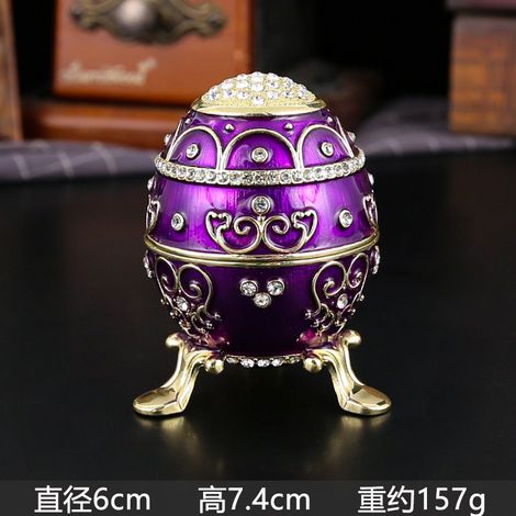 Boîte à bijoux en forme d'œuf, en métal émaillé violet, incrustée de diamants, avec couvercle à charnière et protection anti-poussière. (1/2)
