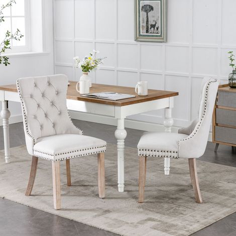 Lot de 2 chaises de salle à manger beige tissu lin capitonné pieds bois massif style moderne élégant clous décoratifs (1/5)