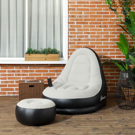 Canapé gonflable et repose-pieds. tissu aspect peluche doux et porte-gobelet. gris