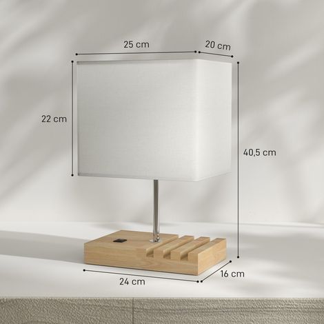 Lampada da tavolo con porte USB-A/C, tre slot per telefono, base in legno e paralume in tessuto, bianca.