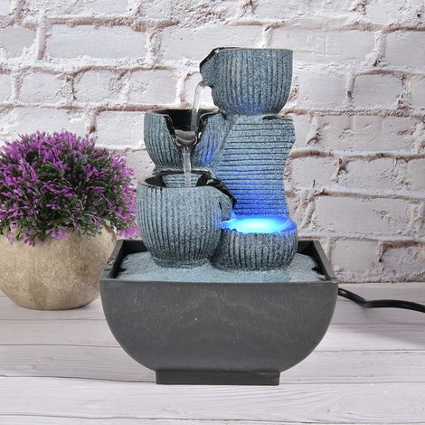 Petite fontaine avec jet d'eau lumineux, décoration paysagère en résine, norme européenne 220. (1/5)