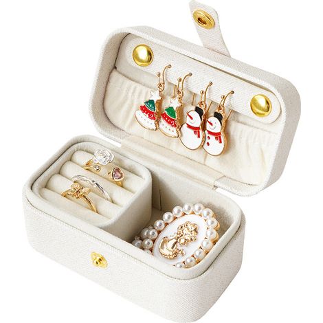 Ce petit organisateur de bijoux de voyage offre de la place pour plusieurs bagues, colliers, boucles d'oreilles, rouges à lèvres, etc. et constitue un organisateur de bijoux portable. (1/5)