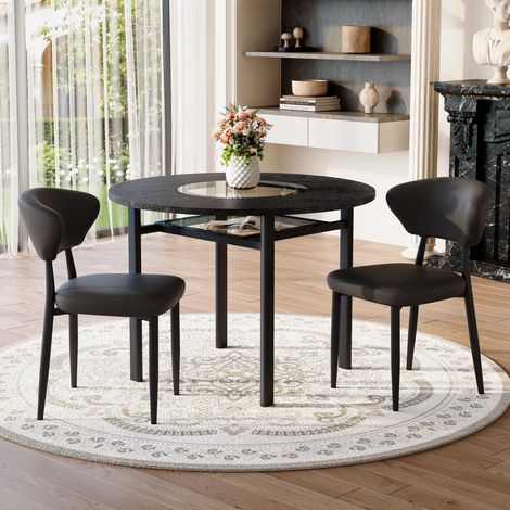 Table ronde noire 100 cm aspect bois + 2 fauteuils similicuir noir dossier courbe, ensemble salon minimaliste confortable.