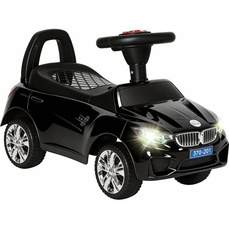 Voiture noire électrique pour enfant avec phares, musique, klaxon, volant, rangement et poignée pour 18 à 36 mois, design sobre pour extérieur pratique
