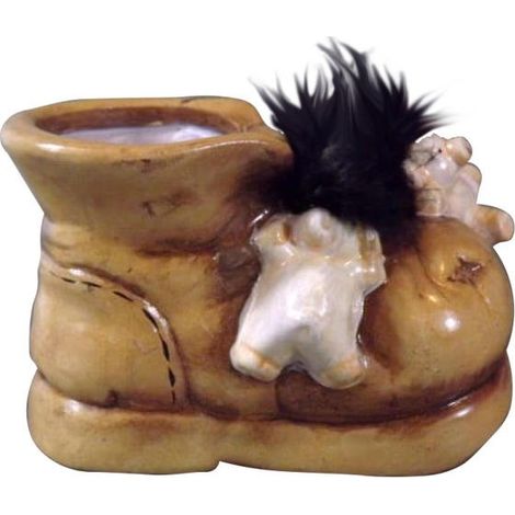 Un coprivaso in ceramica a forma di scarpa con dei maialini giocosi (1/3)