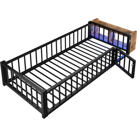 Cama infantil 90 x 200 cm de metal y MDF con barrera, almacenaje abierto y LED negra HOMVRA (1/5)