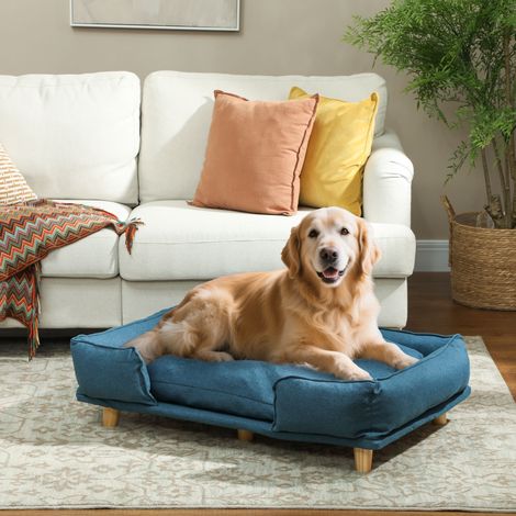 Cuccia rialzata per cani con gambe in legno e cuscino lavabile, portata massima 30 kg, dimensioni 96x66x24 cm, colore blu.