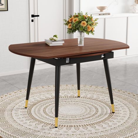 Table de salle à manger extensible moderne, transformable de ronde en ovale, plateau en MDF noir/noyer avec détails dorés, pieds en métal robustes, gain de place pour la cuisine et la salle à manger (1/4)