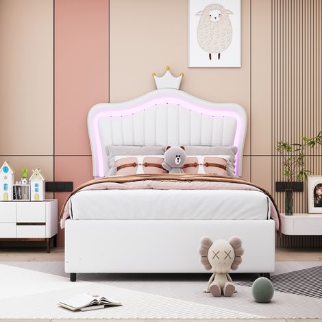 Lit bébé Polsterbett 90x200 cm, cadre fille couronne blanc en simili cuir, tiroirs de rangement, éclairage LED, sommier et tête de lit inclus. (1/5)