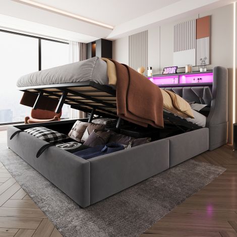 Letto imbottito 180 x 200 cm, letto contenitore idraulico, testiera imbottita ribaltabile con vano contenitore, presa elettrica e ripiano, illuminazione a LED, gambe del letto allargate, tessuto in ve