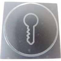 Enjoliveur de finition anthracite avec anneau transparent + symbole clé pour bouton-poussoir 6A lumineux NIKO 122-64009