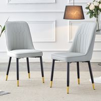 Lot de 2 chaises à manger gris clair moderne,dossier PU rembourré,pieds métal noir,polyvalentes pour salle à manger et cuisine.