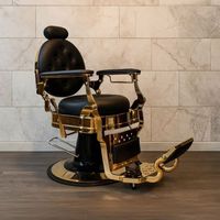 Recliner-Barbierstuhl Ultron in schwarzem Kunstleder mit Armlehnen und glänzender goldfarbener Chromstruktur