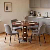 Table à manger ronde et moderne — dotée d'un piètement carré en bois agrémenté d'accents miroités, d'une finition effet noyer et d'un pied central en métal. Idéale pour les cuisines, les salles à mang