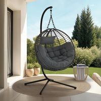 Sillón redondo calado con efecto ratán gris y cojín gris