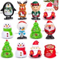 Assortiment de 12 jouets de Noël à remonter : Père Noël, bonhomme de neige, renne, pingouin et lutin. Idéal pour les fêtes, les ca,k