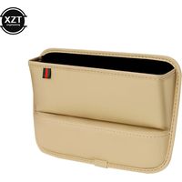 Boîte de rangement universelle beige pour voiture, idéale pour combler l'espace entre les sièges et la console centrale. Accessoire auto pratique et peu encombrant.