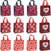 Un lot de 12 sacs cadeaux pour la Saint-Valentin, avec poignées en papier, papier de soie Un cadeau idéal pour la Saint-Valentin.